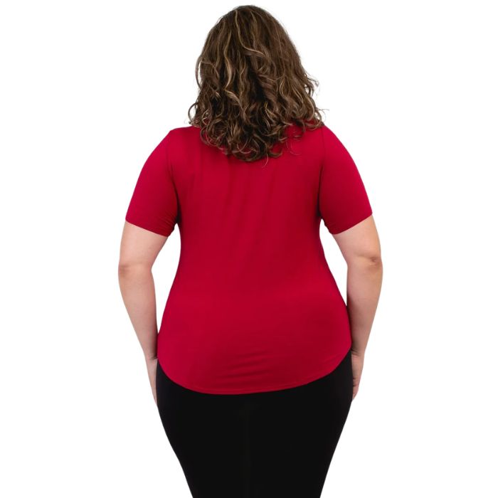 female model wearing lipstick red tessa tee back view on white background