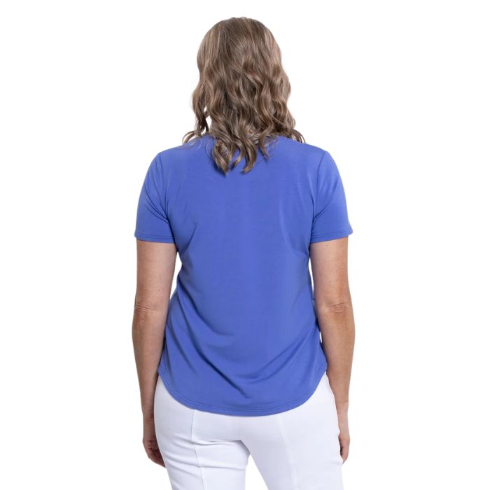female model wearing periwinkle blue tessa tee back view on white background