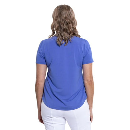 female model wearing periwinkle blue tessa tee back view on white background