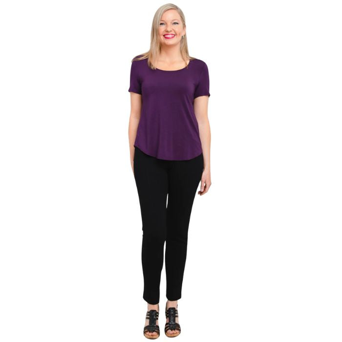 female model wearing royale purple tessa tee and black nadia pants front view on white background