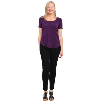 female model wearing royale purple tessa tee and black nadia pants front view on white background