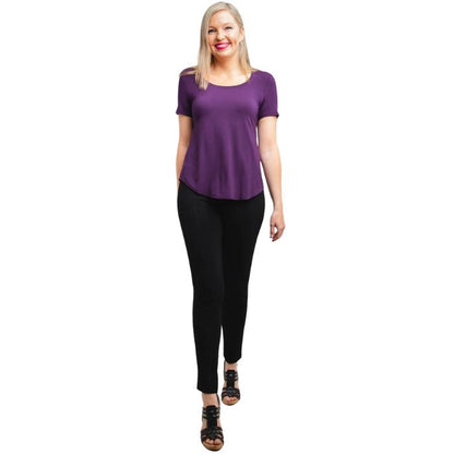 female model wearing royale purple tessa tee and black nadia pants front view on white background