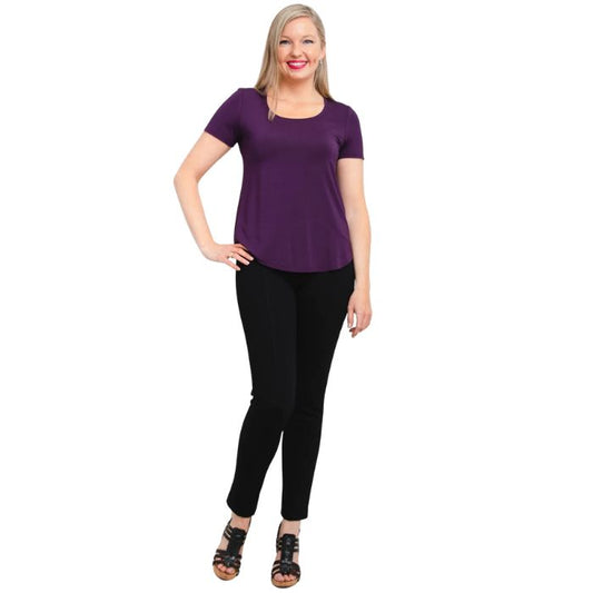 female model wearing royale purple tessa tee and black nadia pants front view on white background
