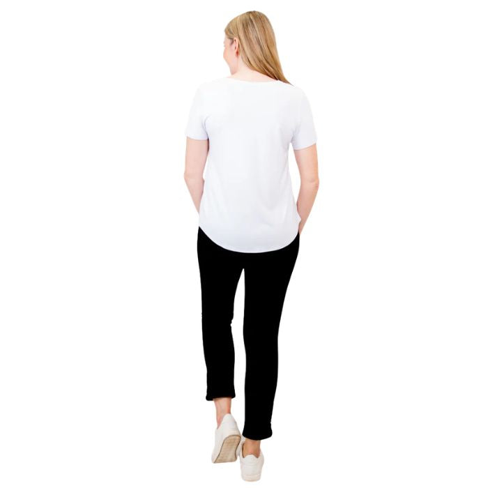 female model wearing white tessa tee and black nadia cropped pants back view on white background