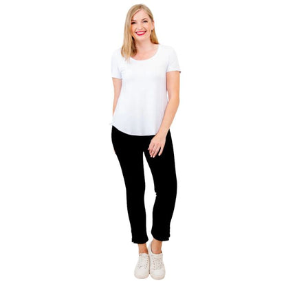 female model wearing white tessa tee and black nadine cropped pants front view on white background