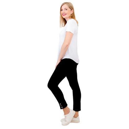 female model wearing white tessa tee and black nadine cropped pants side view on white background