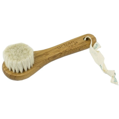 the bamboo and wool facial brush over view on white background