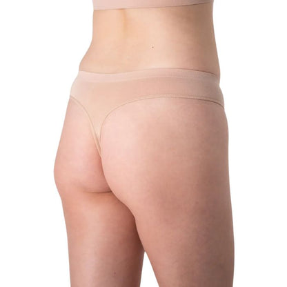 female model wearing beige thong underwear front view on white background