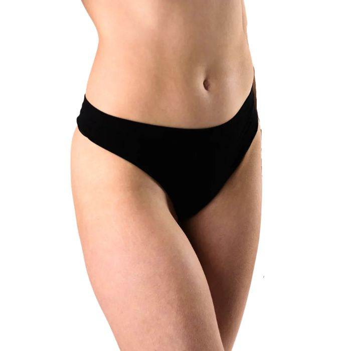 female model wearing black thong underwear front view on white background