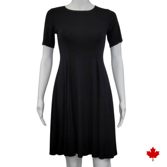 mannequin wearing black twirl dress front view on white background