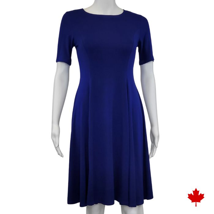 mannequin wearing indigo blue twirl dress front view on white background