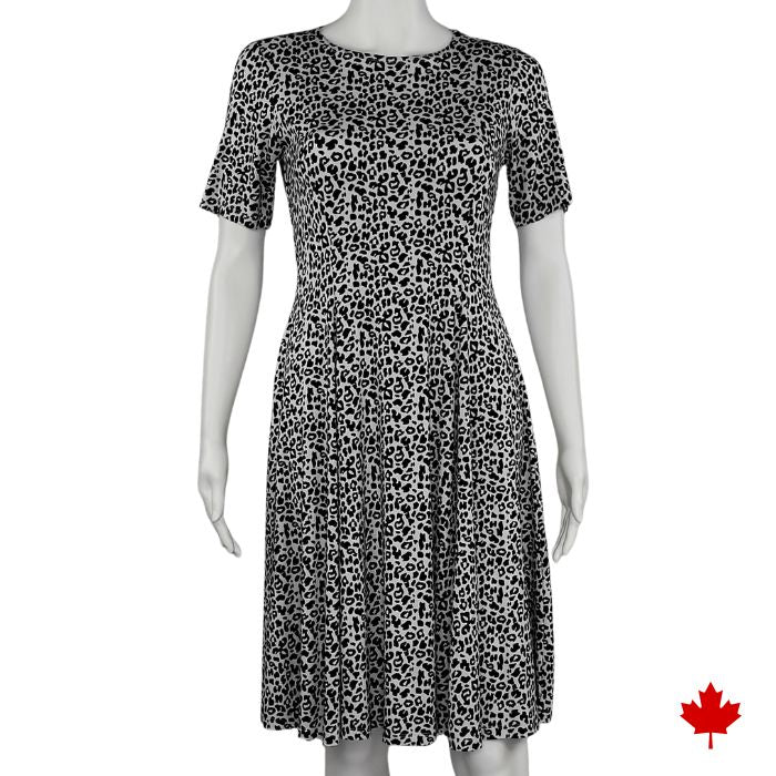 mannequin wearing leopard print twirl dress front view on white background