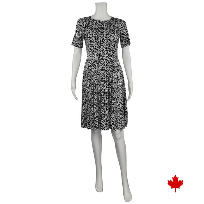 mannequin wearing leopard print twirl dress front view on white background