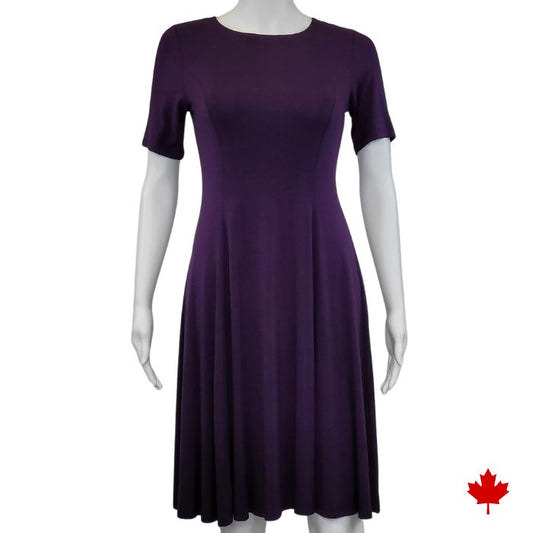 mannequin wearing plum purple twirl dress front view on white background