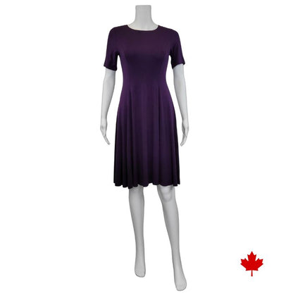 mannequin wearing plum purple twirl dress front view on white background