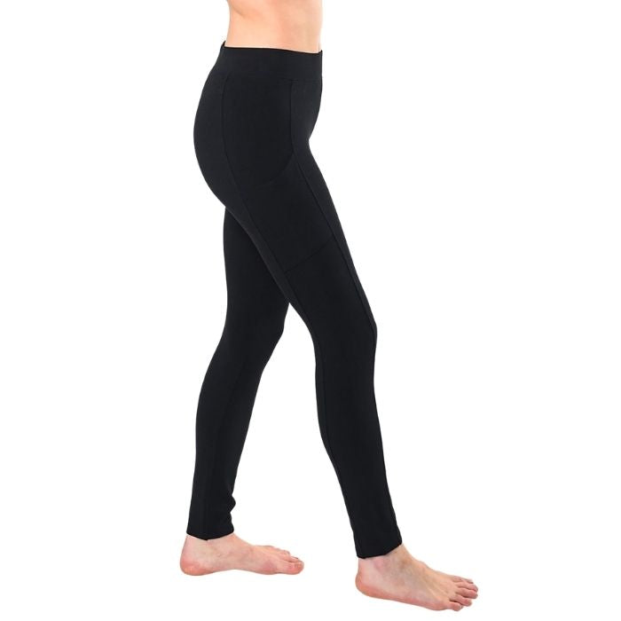 female model wearing black viva pocket leggings side view on white background
