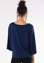 The Beckett Top is an elevated staple piece made to last through many seasons. Designed with a flattering boat-neck, relaxed bell sleeves, and a roomy silhouette. Great to wear anywhere, you will love this top. Fabrication: 95% Viscose from Bamboo 5% Spandex French Terry TERRERA Ink Blue $90.00