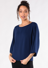 The Beckett Top is an elevated staple piece made to last through many seasons. Designed with a flattering boat-neck, relaxed bell sleeves, and a roomy silhouette. Great to wear anywhere, you will love this top. Fabrication: 95% Viscose from Bamboo 5% Spandex French Terry TERRERA Ink Blue $90.00