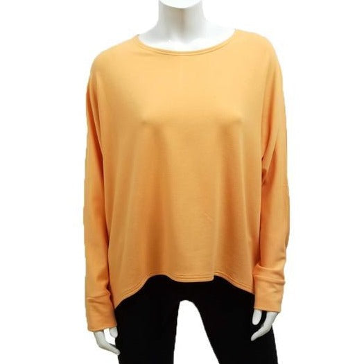  A throw on your body and go piece; the French Terry Sweatshirt has a high/ low hemline, loose Dolman sleeves. Made of Bamboo it is cool in the summer and warm in the winter making it an excellent choice that can be worn all year round.  (One Size)  Proudly Made in Canada  Fabrication: 66% Bamboo, 28% Cotton, 6% Spandex  GILMOUR $97.00 cantaloupe orange 