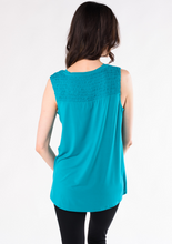 The Janice V-Neck Blouse is an easygoing tank and will be your favourite tank top for the warmer weather. The beautiful smock detailing at the shoulder is accentuated by a flattering V-neck. Made with signature organic viscose from bamboo that’s breathable and soft. Fabrication: 95% Viscose from Bamboo 5% Spandex TERRERA Turquoise Green $65.00