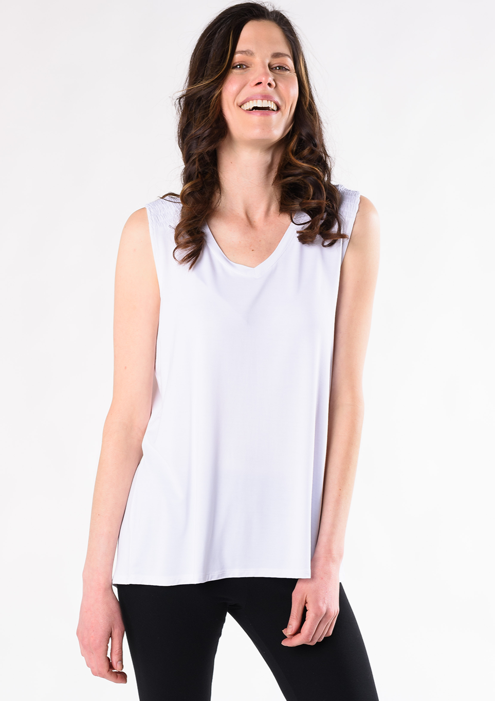 The Janice V-Neck Blouse is an easygoing tank and will be your favourite tank top for the warmer weather. The beautiful smock detailing at the shoulder is accentuated by a flattering V-neck. Made with signature organic viscose from bamboo that’s breathable and soft. Fabrication: 95% Viscose from Bamboo 5% Spandex TERRERA White $65.00