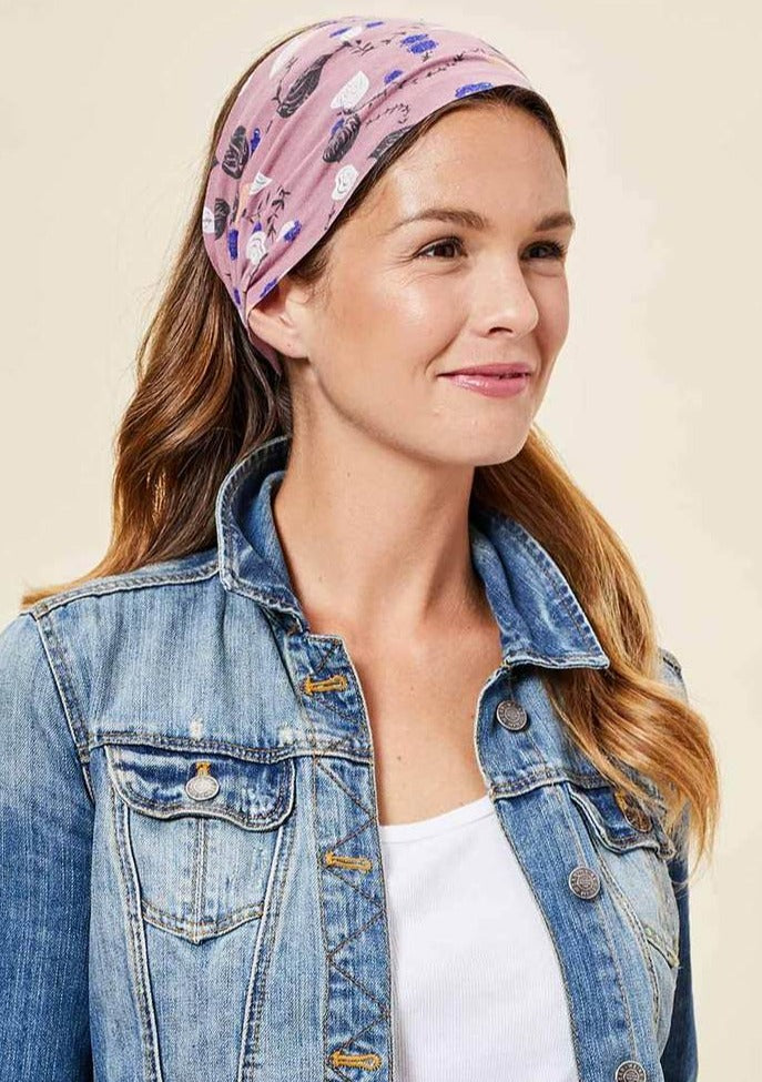 This Is J's Wide Headbands reverse from a unique print to a solid color. The fabric is ultra-soft and moisture-wicking and is soft enough to scrunch and fold into different widths. It comes twisted in the back for a comfortable tapered fit.  Made in Canada  Fabrication: 93% Viscose from Bamboo 7% Spandex. $16.00 palm leaf dusty rose pink