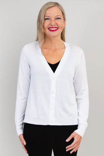 The Jessica Sweater is a layering piece in a universal shape. Deep V neckline, shell buttons, vents at hip for no cling. A perfect light sweater for over any look.  Fabrication: 50% Bamboo, 50% Cotton  BLUE SKY  Blue Sky fit guide - true to size for a relaxed finish $65.00 White