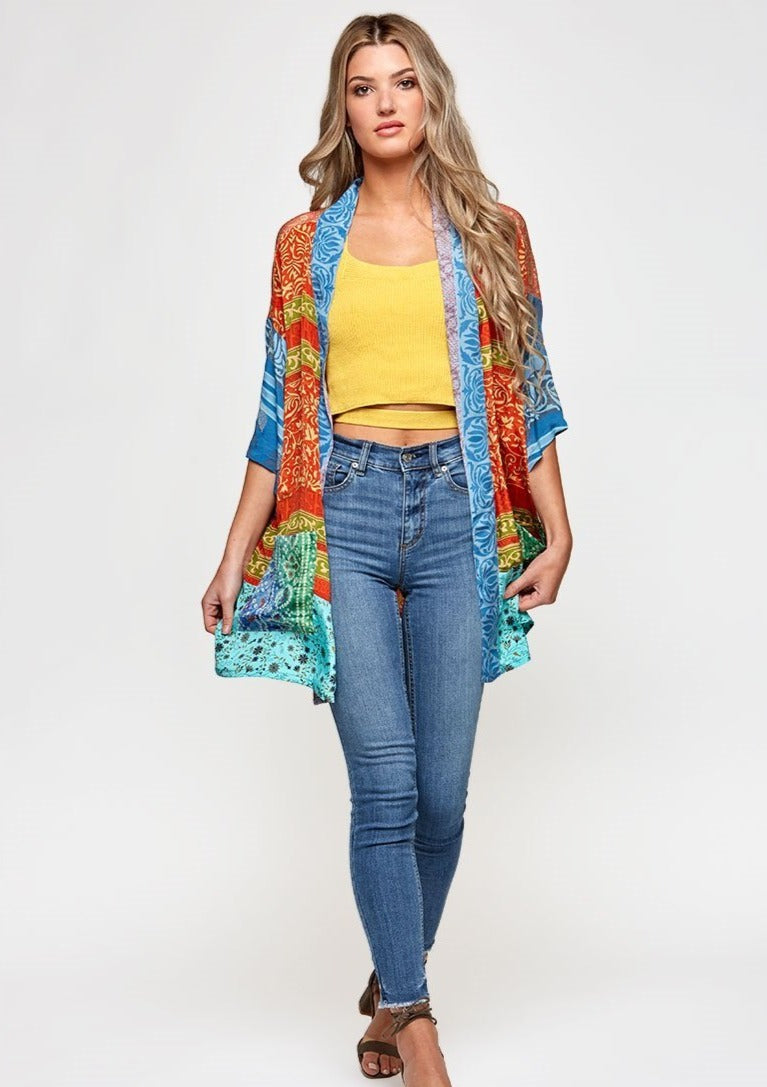 The Kind Kimono is made with upcycled saris, that have an amazing history.  Each of the high quality Rasgulla saris are collected by bartering in Indian villages and are re-fashioned by Guru for you! Step 1- Pick your style  Step 2- Pick your size Step 3- Pick a Light or a Dark Print Step 4- You receive a Specially selected one of a kind piece just for YOU! GURU FOR LIFE $125