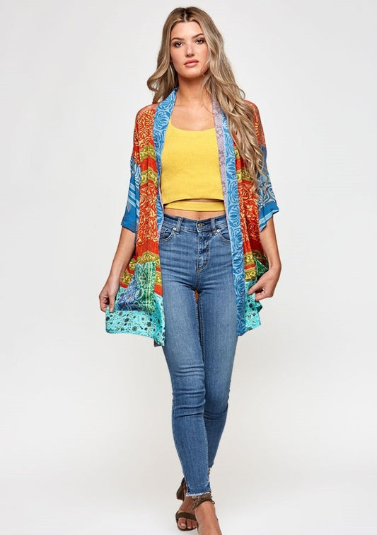 The Kind Kimono is made with upcycled saris, that have an amazing history.  Each of the high quality Rasgulla saris are collected by bartering in Indian villages and are re-fashioned by Guru for you! Step 1- Pick your style  Step 2- Pick your size Step 3- Pick a Light or a Dark Print Step 4- You receive a Specially selected one of a kind piece just for YOU! GURU FOR LIFE $125