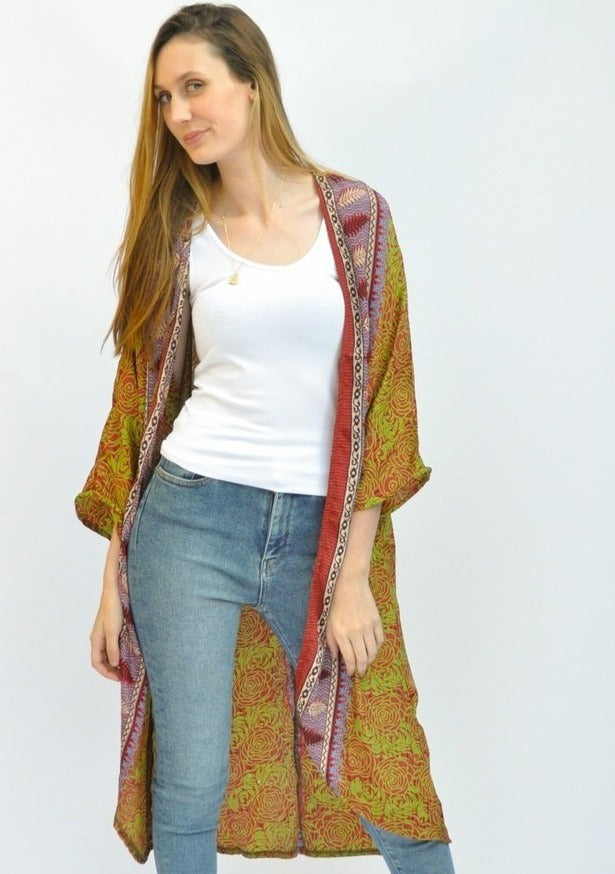 The Metaphysical Duster is made with upcycled saris, that have an amazing history.  Each of the high quality Rasgulla saris are collected by bartering in Indian villages and are re-fashioned by Guru for you! Step 1- Pick your style  Step 2- Pick your size Step 3- Pick a Light or a Dark Print Step 4- You receive a Specially selected one of a kind piece just for YOU! GURU FOR LIFE $125