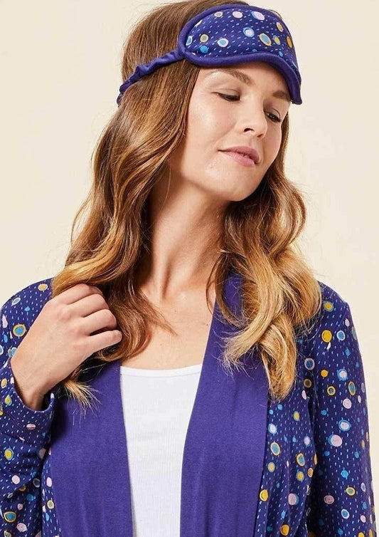 The Carly Sleep Mask filter out lights and other disturbances so that you can get the rest you need. Made from This Is J's ultra-soft and hand-printed fabric. Fits comfortably on all head sizes with a soft scrunch elastic band that goes around the back of the head.  Made in Canada.  Fabrication: 93% Viscose from Bamboo 7% Spandex. $35.00 violet raining circle purple