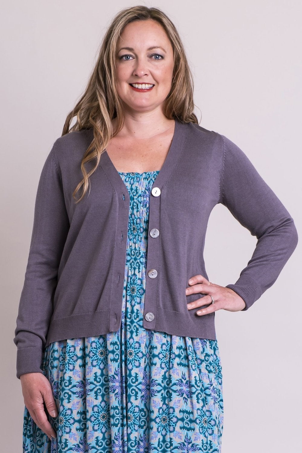 The Jessica Sweater is a layering piece in a universal shape. Deep V neckline, shell buttons, vents at hip for no cling. A perfect light sweater for over any look.  Fabrication: 50% Bamboo, 50% Cotton  BLUE SKY  Blue Sky fit guide - true to size for a relaxed finish $65.00 Ash Grey