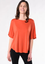 This is sure to be your favourite everyday tee. Casual and easy to slip on, the Laura Relaxed Fit Blouse features a relaxed fit body, curved hem detail, forward to front seams, and a universally flattering boat neck.  Fabrication: 95% Viscose from Bamboo 5% Spandex TERRERA $60.00 Tangerine Orange