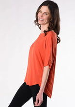 This is sure to be your favourite everyday tee. Casual and easy to slip on, the Laura Relaxed Fit Blouse features a relaxed fit body, curved hem detail, forward to front seams, and a universally flattering boat neck.  Fabrication: 95% Viscose from Bamboo 5% Spandex TERRERA $60.00 Tangerine Orange