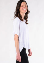 This is sure to be your favourite everyday tee. Casual and easy to slip on, the Laura Relaxed Fit Blouse features a relaxed fit body, curved hem detail, forward to front seams, and a universally flattering boat neck.  Fabrication: 95% Viscose from Bamboo 5% Spandex TERRERA $60.00 White