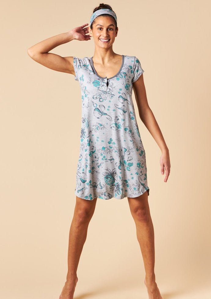 Softly draped fabric, thoughtful detail, and a flattering fit make the Silvia Short Sleeve Nightie the most comfortable nightdress you will ever wear. This set includes a loose and flowy knee length cap sleeve dress with keyhole detail that can be buttoned closed, and a matching headband. Made from This is J's signature moisture wicking bamboo/spandex fabric blend. Proudly Made in Canada Fabrication: 93% Bamboo Viscose 7% Spandex $95.00 toile heather grey