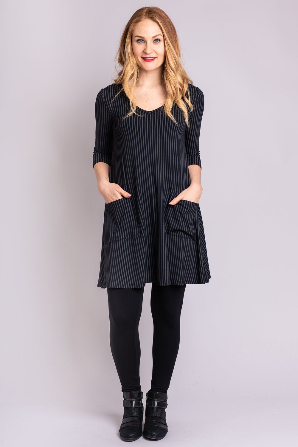 The Veronica Tunic is a great addition to your wardrobe, its princess seaming allows an easy fit over the upper body. A V-neckline suggests a vertical axis and adds a contemporary feel. The lower section falls from the high hip into a forgiving flare: the swing of fabric brings texture and movement around the hips.  Fabrication: 67% Bamboo, 28% Cotton, 5% Lycra  BLUE SKY $85.00 colour black/grey stripe