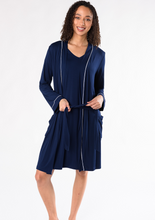 You deserve the Mia Luxe Robe to lounge in. Made with signature soft viscose from bamboo, this robe feels cooling and smooth on the body. You’ll love the side pockets, elegant white piping and self belt. Perfect as a gift! Fabrication: 95% Viscose from Bamboo 5% Spandex TERRERA Ink Blue $95.00