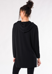 The Emily Tunic Hoodie is the perfect lounge piece. You can easily wear this hoodie with a pair of jeans or leggings. Made with dropped shoulder styling and soft hood with drawstrings, it also has side slits for added detail and movement. Fabrication: 95% Viscose from Bamboo 5% Spandex French Terry TERRERA $100.00 Black