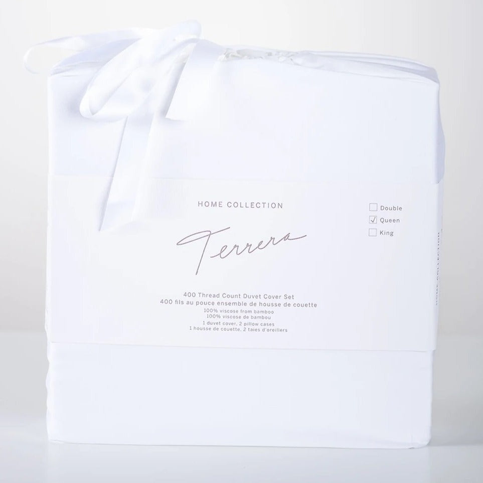 We spend one third of our lives in bed, so why not choose the best? Slip under the ultra-soft and cool-to-touch Terrera Luxury Duvet & Pillowcase Set. Made with their signature viscose from bamboo, which is comfortable, breathable, and oh so soft - an excellent option for those with sensitive skin. Includes 400 thread count Duvet Cover with snap closures at the bottom,4 ties inside to hold duvet in place and 2 pillow cases.  Fabrication: 100% Viscose from Bamboo TERRERA White $150/$160/$190