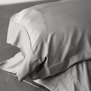 Lay your head on the ultra-soft Terrera Bamboo Pillowcase. Made with their signature eco-friendly bamboo viscose, which is naturally thermo-regulating and breathable - an excellent option for those with sensitive skin. The 400 Thread count guarantees you'll wake up feeling refreshed. (2/Set) Fabrication: 100% Certified Organic Viscose from Bamboo TERRERA Grey $30/$33