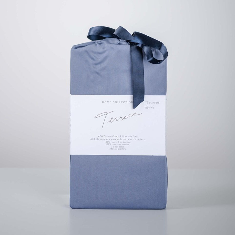 Lay your head on the ultra-soft Terrera Bamboo Pillowcase. Made with their signature eco-friendly bamboo viscose, which is naturally thermo-regulating and breathable - an excellent option for those with sensitive skin. The 400 Thread count guarantees you'll wake up feeling refreshed. (2/Set) Fabrication: 100% Certified Organic Viscose from Bamboo TERRERA Mineral Blue $30/$33