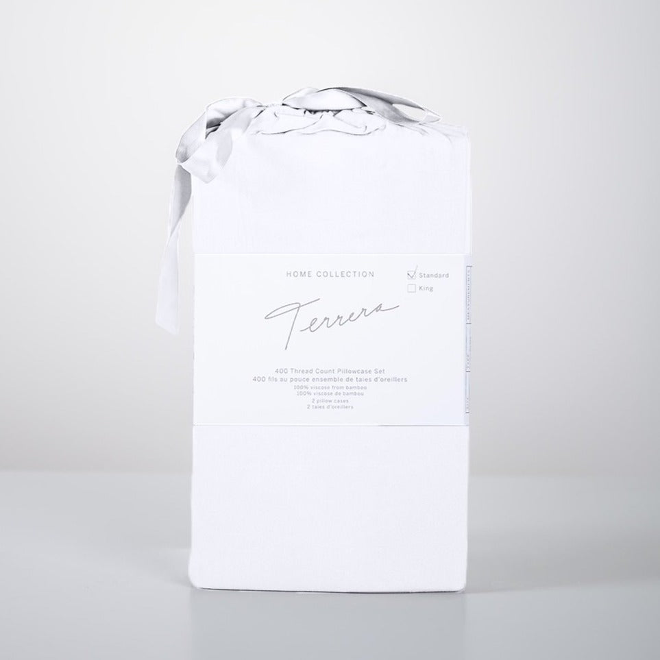 Lay your head on the ultra-soft Terrera Bamboo Pillowcase. Made with their signature eco-friendly bamboo viscose, which is naturally thermo-regulating and breathable - an excellent option for those with sensitive skin. The 400 Thread count guarantees you'll wake up feeling refreshed. (2/Set) Fabrication: 100% Certified Organic Viscose from Bamboo TERRERA White $30/$33
