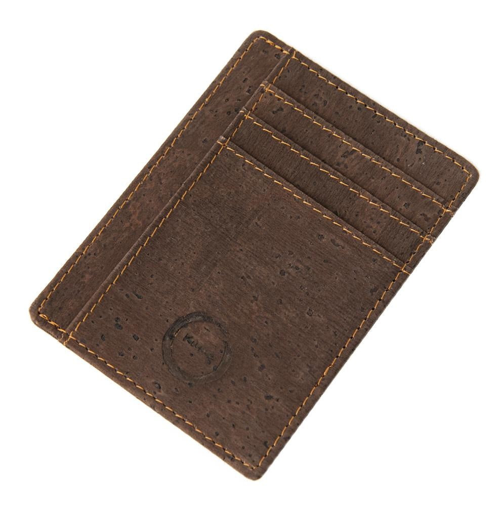 The Cork Card Holder is crafted from vegan and sustainable cork. This sleekly designed card holder features 6 card slots, 1 transparent holder for ID and a center slot for cash or more cards.  KUMA $34.00 colour Brown