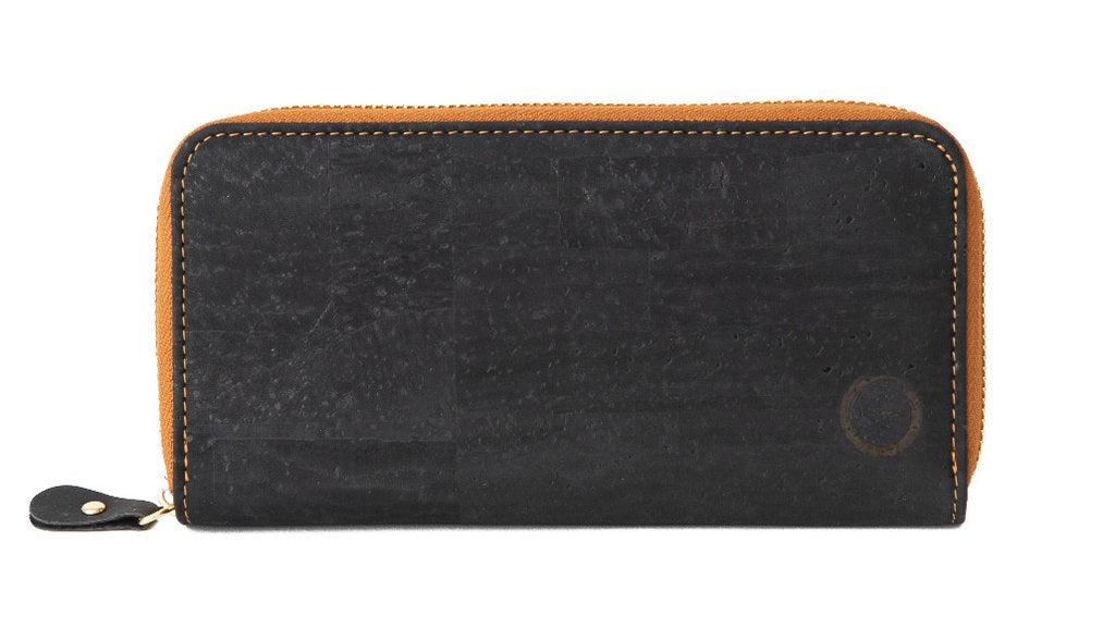 The sleek Cork Clutch is made with layered sustainable natural cork. With a zippered interior pocket  the cork clutch will fit your cash, coins, up to 24 cards and most cell phones! The sustainable accessory for coffee with an old friend or a night on the town.  KUMA $48.00 colour Black