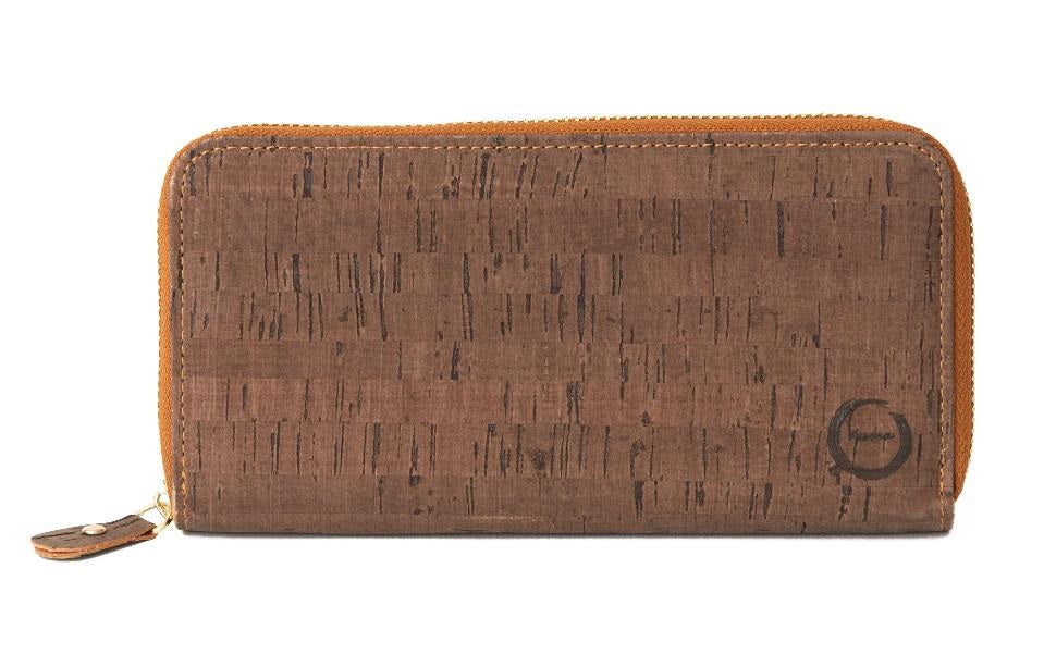 The sleek Cork Clutch is made with layered sustainable natural cork. With a zippered interior pocket  the cork clutch will fit your cash, coins, up to 24 cards and most cell phones! The sustainable accessory for coffee with an old friend or a night on the town.  KUMA $48.00 colour Brown