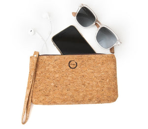 Keep your hands free and the essentials close by with the Kuma cork wristlet. Made with sustainable natural colored cork and a secure outer zipper our wristlet makes it perfect for on the go. KUMA $32.00 colour natural