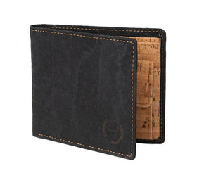 Crafted from vegan and sustainable cork, the Dark Cork Wallet features a sleek design that unfolds to reveal a well-organized interior. With plenty of card slots, a buttoned compartment for coins or keys and a divided internal currency sleeve, it carries everything you need!  1 Tree Planted For Every Item Sold!   Crafted From Natural Sustainable Cork.  KUMA $40.00
