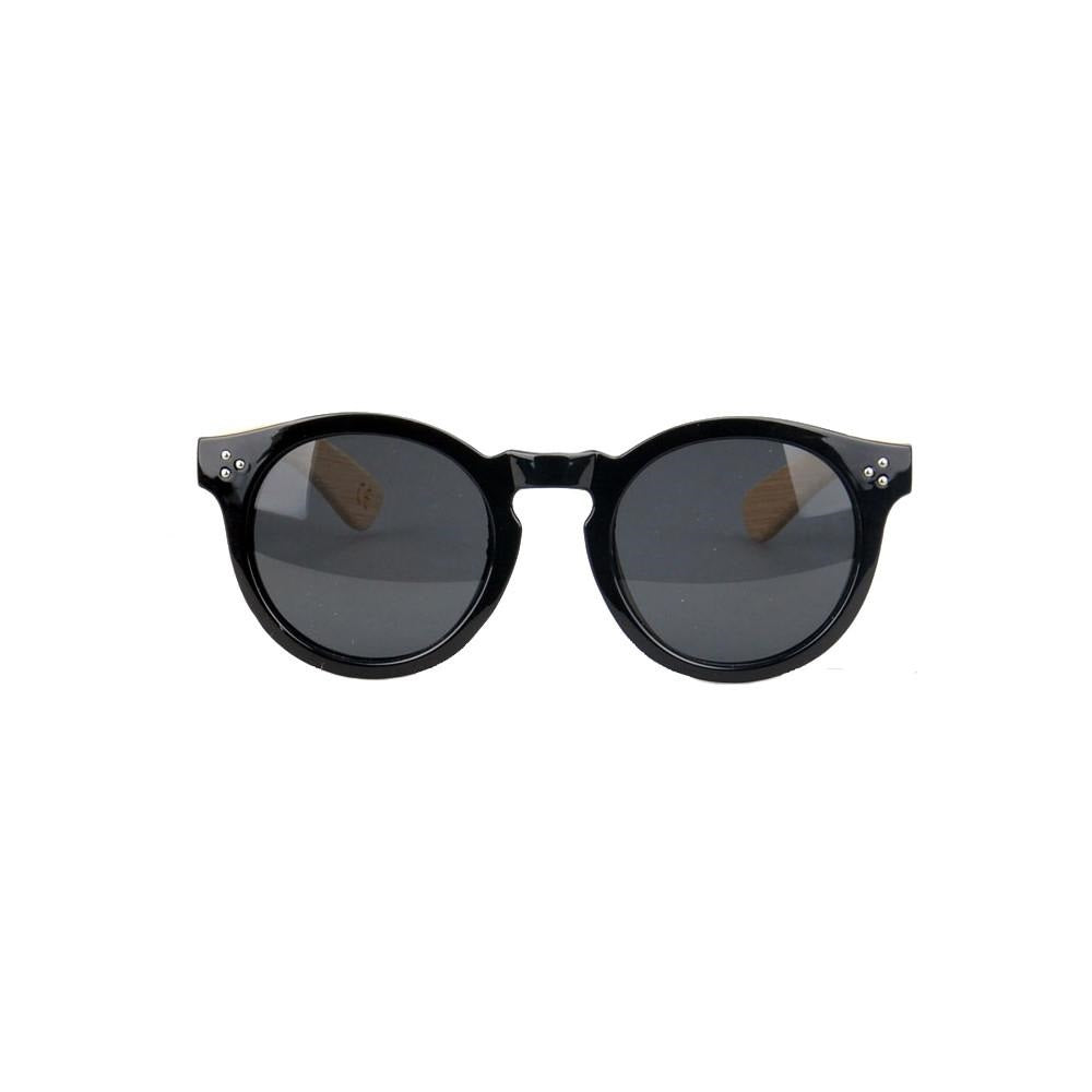 Kuma's Mango frame has a modern silhouette with a lineage rooted in the classics, the Mango's rounded frame and keyhole bridge detail matched with handcrafted natural bamboo temples bring this frame to a whole new level.  KUMA Plants a Tree for Every Pair Sold! 100% UVA/UVB protection Handcrafted Natural Bamboo Temples KUMA $35.00 Black