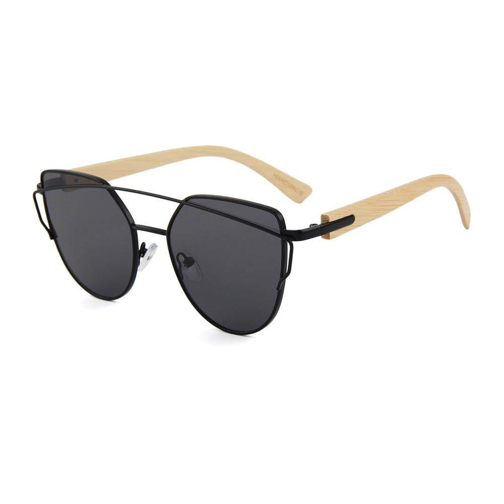 Inspired by the flat leaves and delicate but strong branches of the Olive tree the timeless design of our Olive Sunglasses with its delicate lines and flat mirrored lens hearkens back to an earlier time all while embodying fashion forward design and natural elements!  KUMA Plants a Tree for Every Pair Sold! 100% UVA/UVB protection Handcrafted Natural Bamboo Temples KUMA $35.00 Black